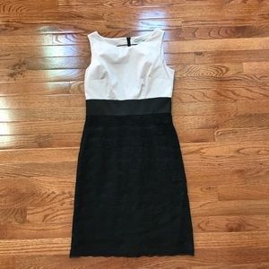 Sleeveless dress with black lace skirt portion